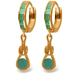 Four-stone earrings-14K. SOLID ROSE GOLD HUGGIE EARRINGS WITH DANGLING EMERALDS