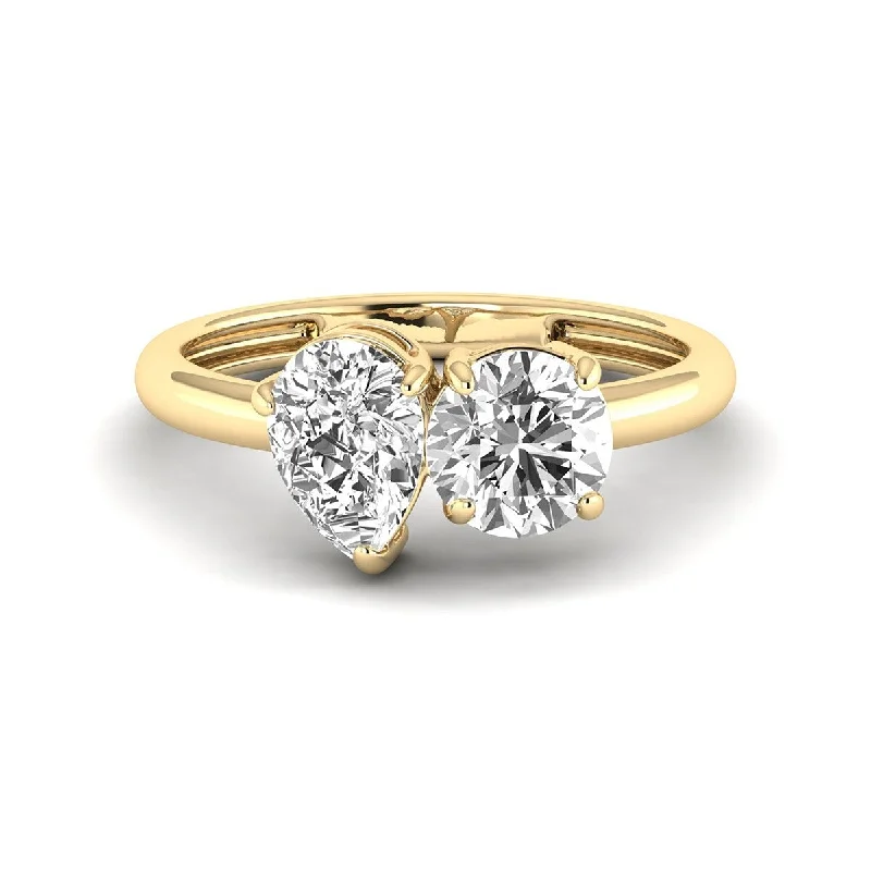 Dimpled ring-Marquee Almost 2.50 Carat TW Round And Pear Shape Lab Grown Diamond Ring in 14K Yellow Gold